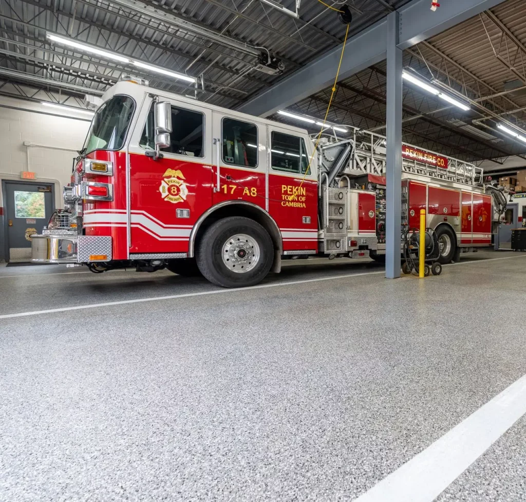 firetruck in firehouse with polyurea concrete coating