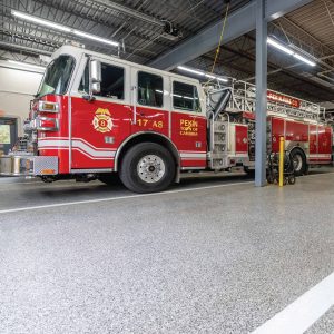 firetruck in firehouse with polyurea concrete coating