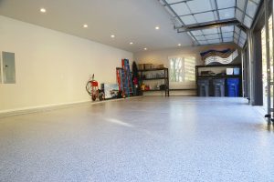 garage ready for school year with organization and freshly coated concrete floors