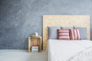 Grey bedroom with diy, wood bed and crate side table