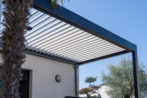 Trendy outdoor patio pergola shade structure, awning and patio roof.